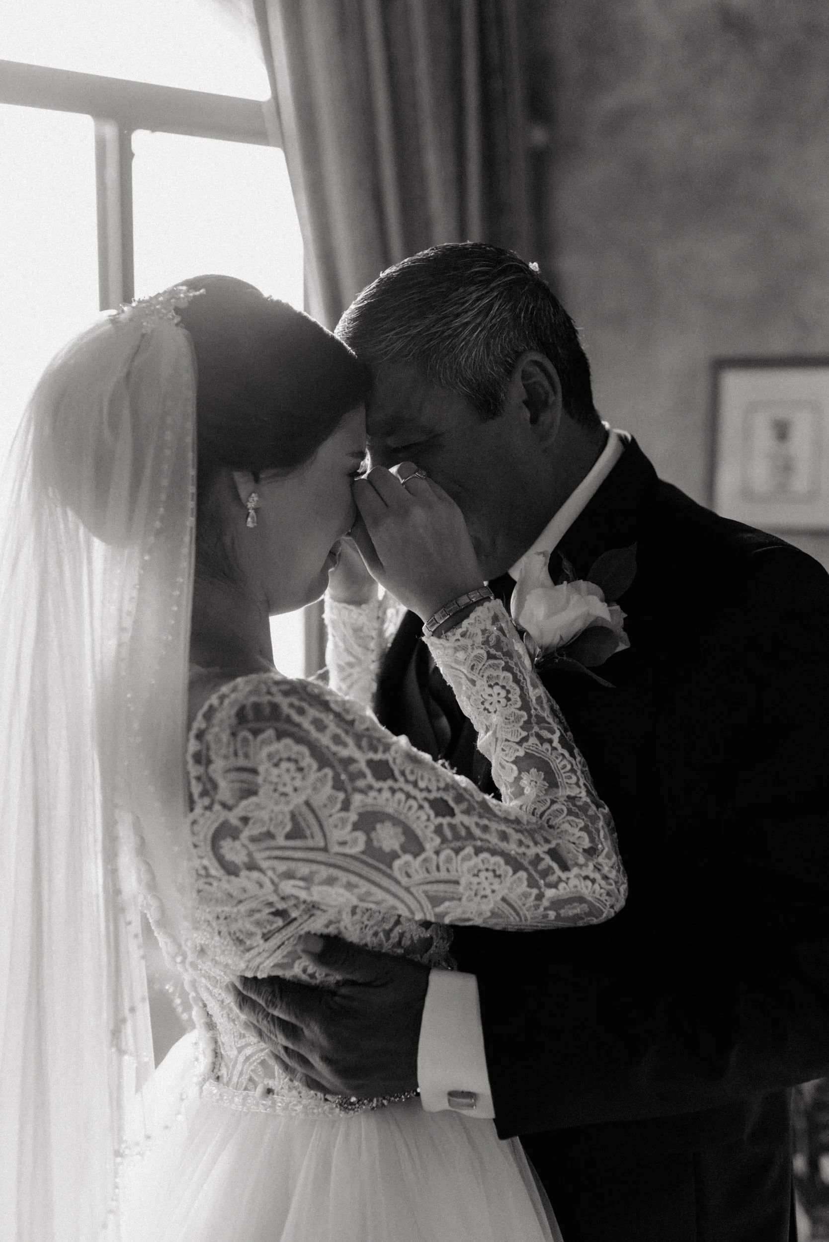 Groom coming out of bathing and putting on his suit for his wedding