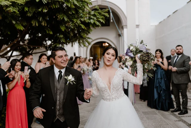 Daddy's groom helping to put on his shirt for his wedding