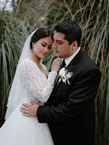Sister of the groom smiling and putting perfume on her