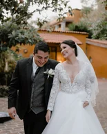 Boyfriend smiling before seeing his fiancee for the first look